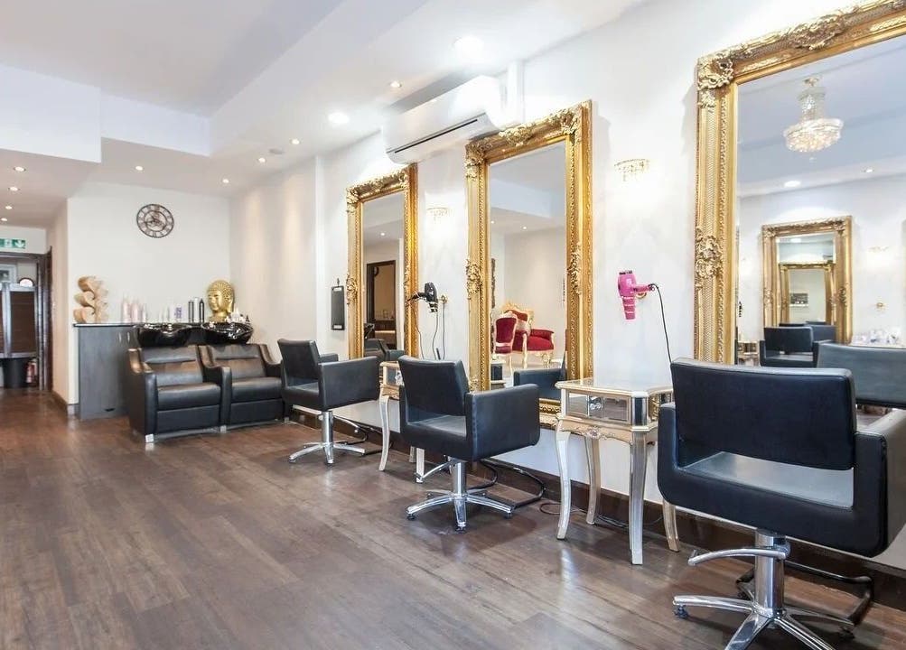 Sophisticated interior of Wink Spa in Feltham, England, GB with luxurious styling stations and ornate mirrors.