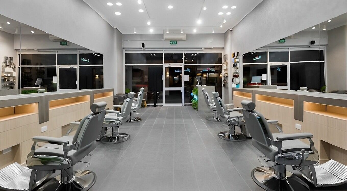 Inside The Barber Club | Richmond, sleek salon with modern chairs and mirrors. Richmond, Victoria, AU location.