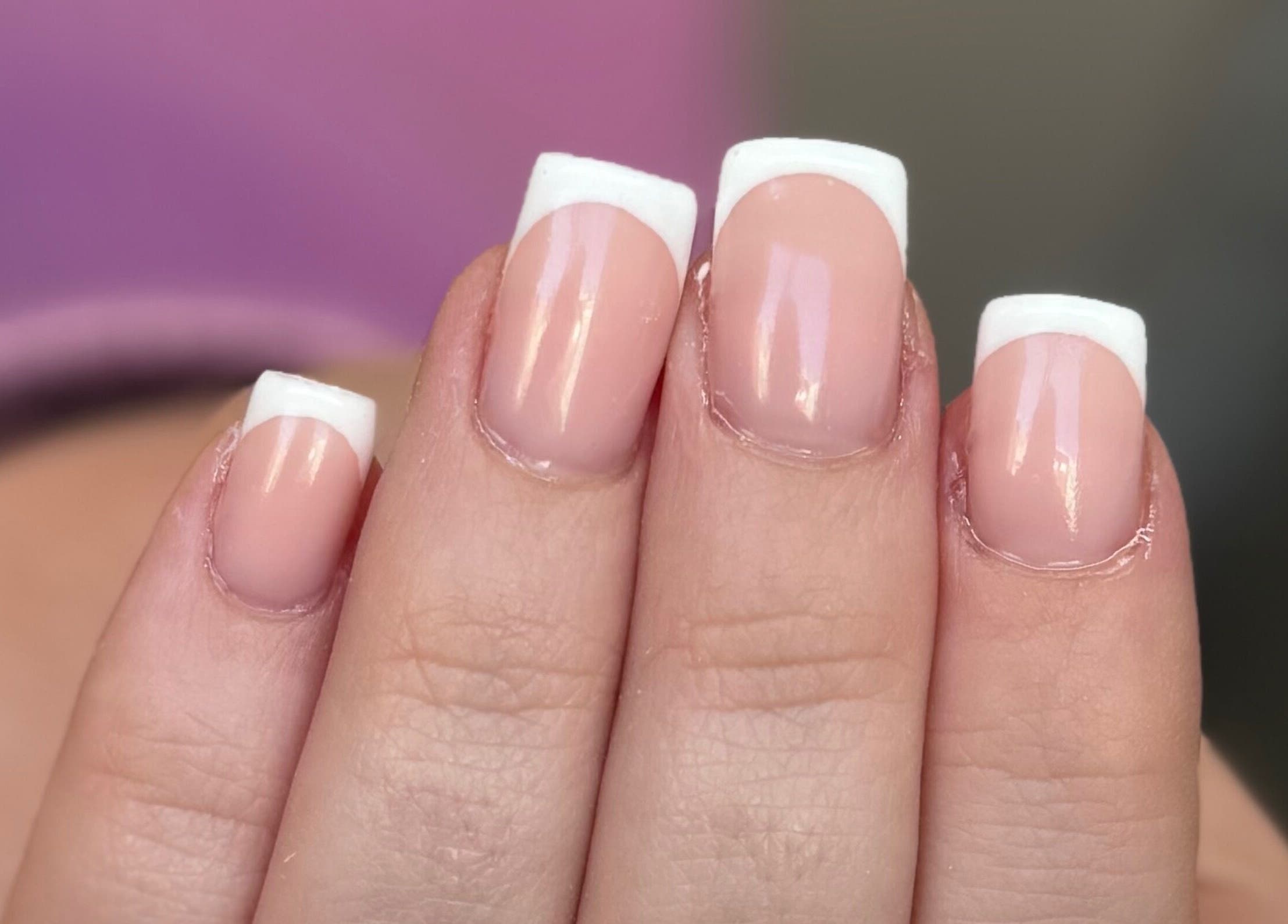 Elegant French manicure by Nicole Mc Arthur Nail Tech in Ayr, Scotland, GB, showcasing glossy white tips.