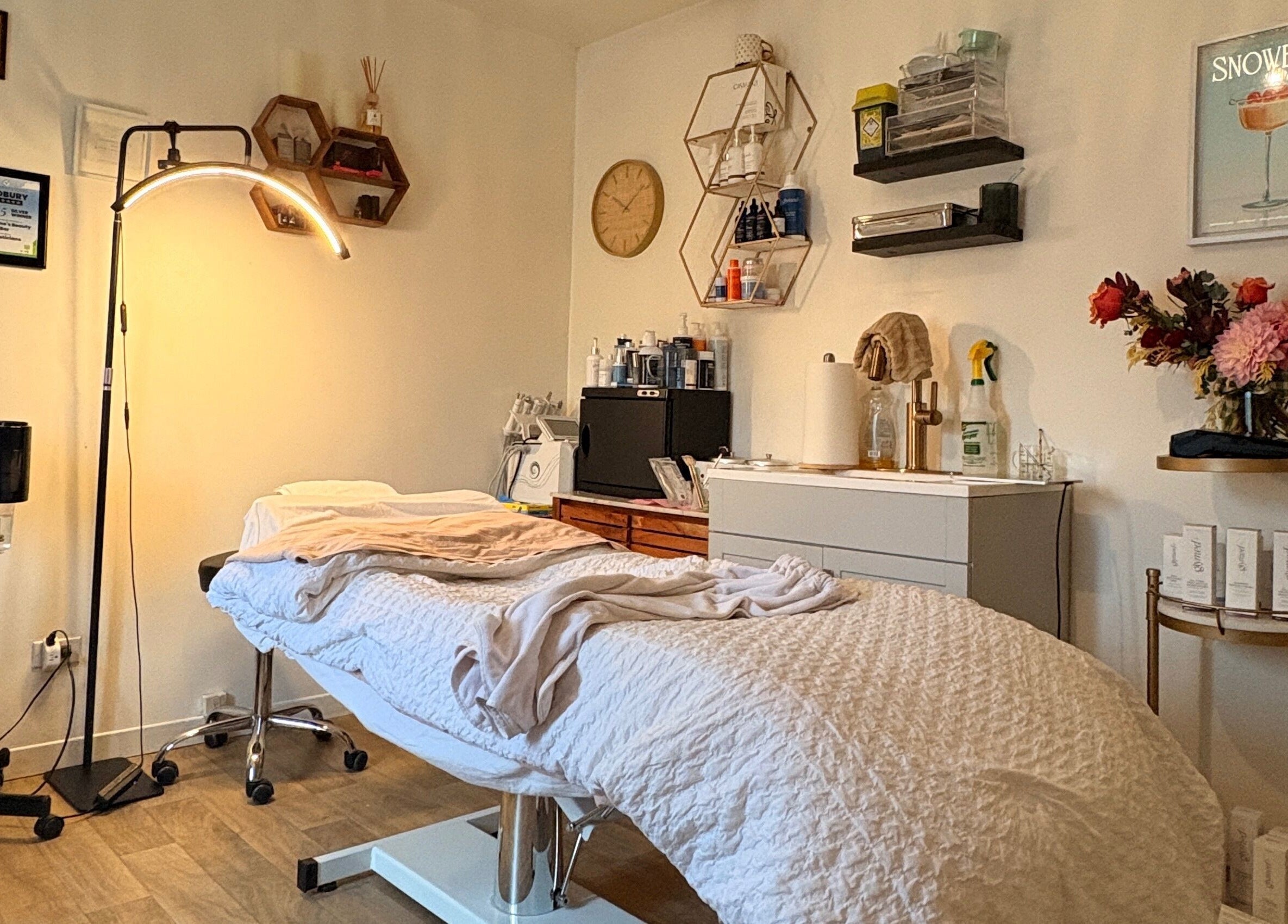 Relaxing massage room at Bellissimos Beauty Bar, Greater Sudbury, Ontario, CA, with cozy decor and ambient lighting.