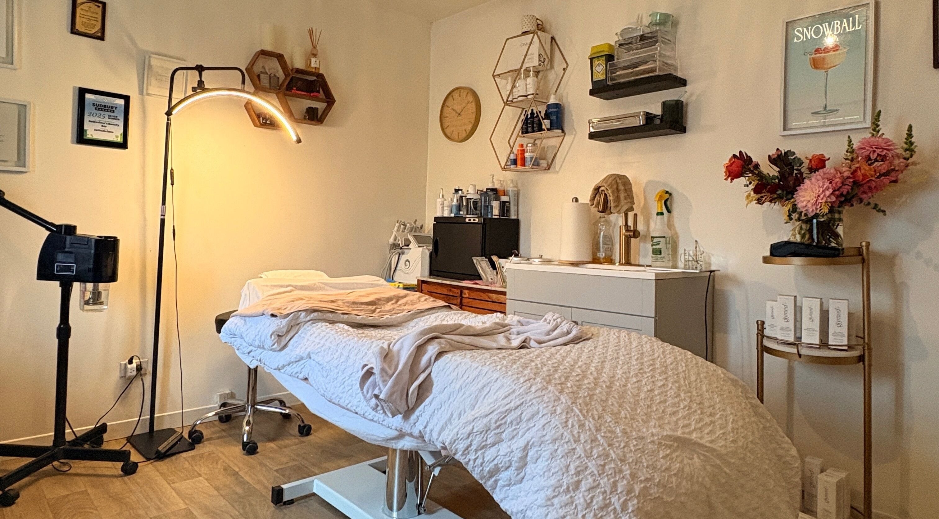 Relaxing massage room at Bellissimos Beauty Bar, Greater Sudbury, Ontario, CA, with cozy decor and ambient lighting.
