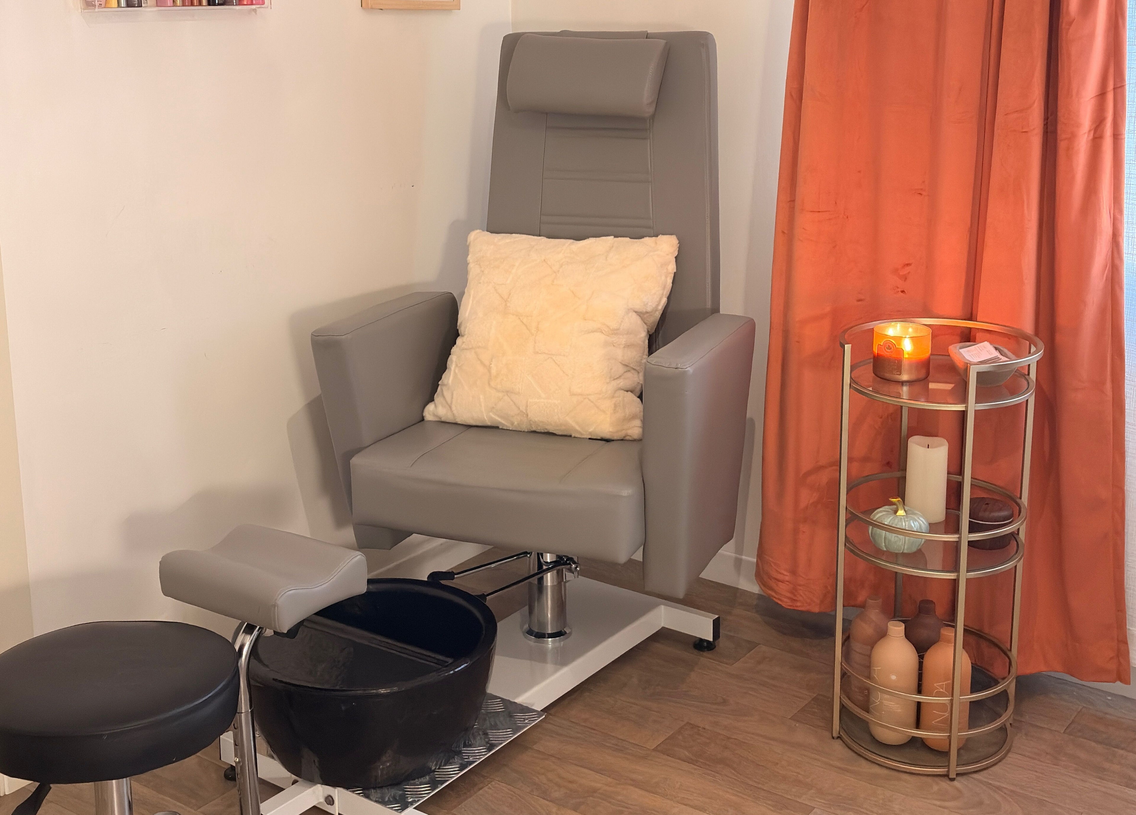 Pedicure station at Bellissimos Beauty Bar, Greater Sudbury, Ontario, CA with plush chair and cozy decor.