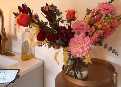 Elegant floral arrangement at Bellissimos Beauty Bar, Greater Sudbury, Ontario, CA showcases warm, inviting ambiance.