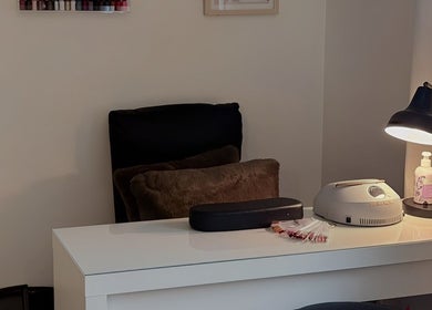 Nail station at Bellissimos Beauty Bar in Greater Sudbury, Ontario, CA, featuring lamp and manicure tools.