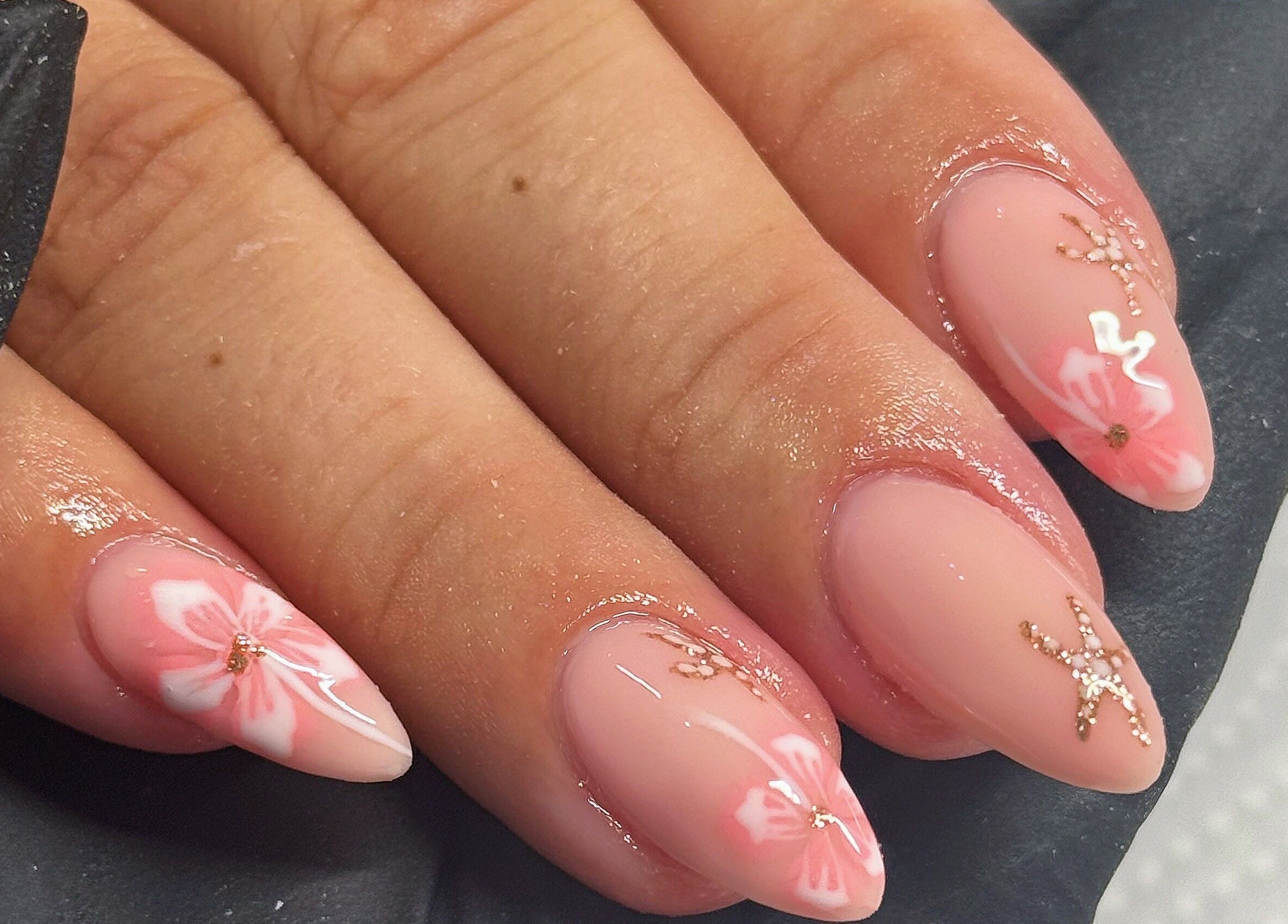 Pink floral nail art design at Touch Of Beauty, Blyth, England, GB.