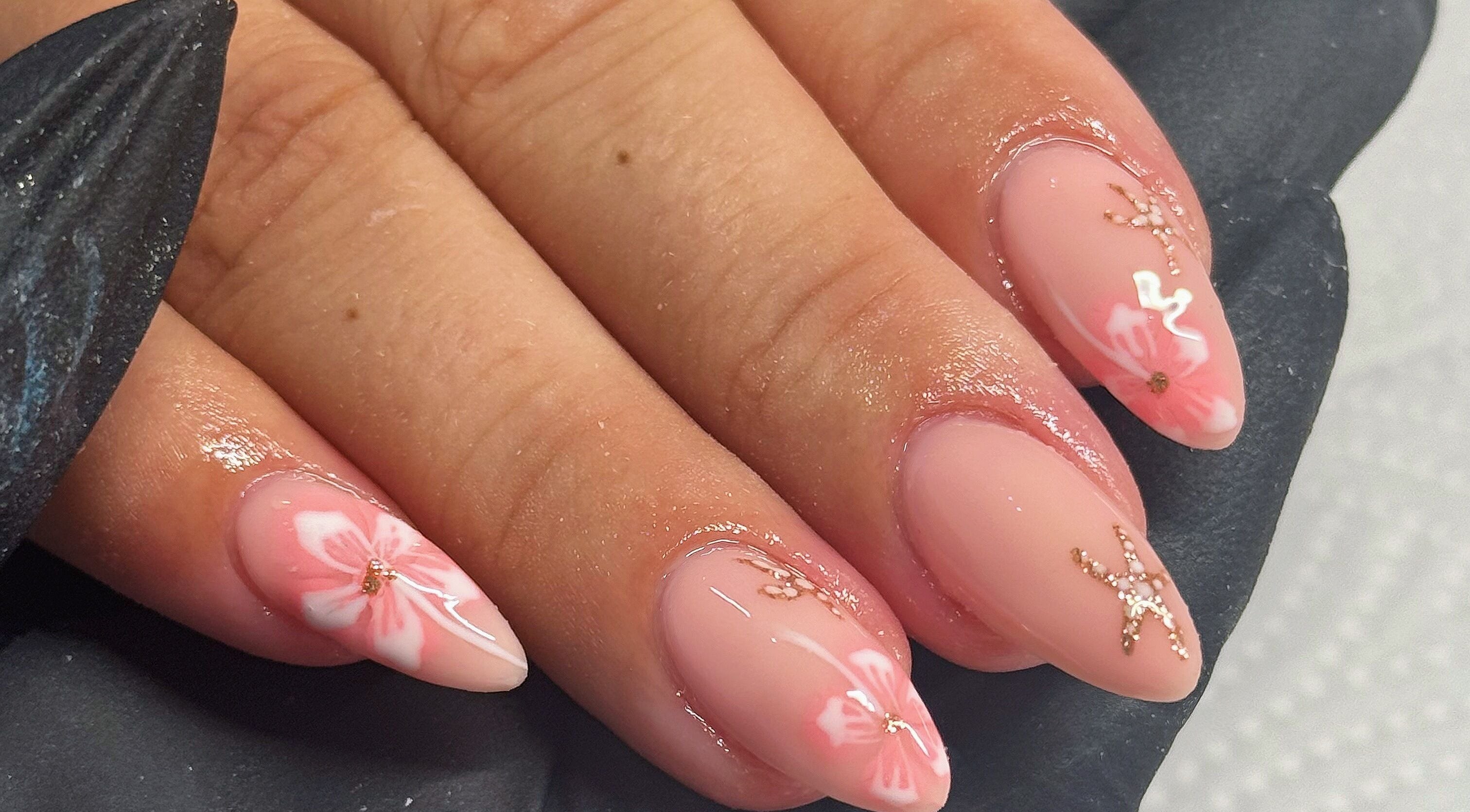 Pink floral nail art design at Touch Of Beauty, Blyth, England, GB.