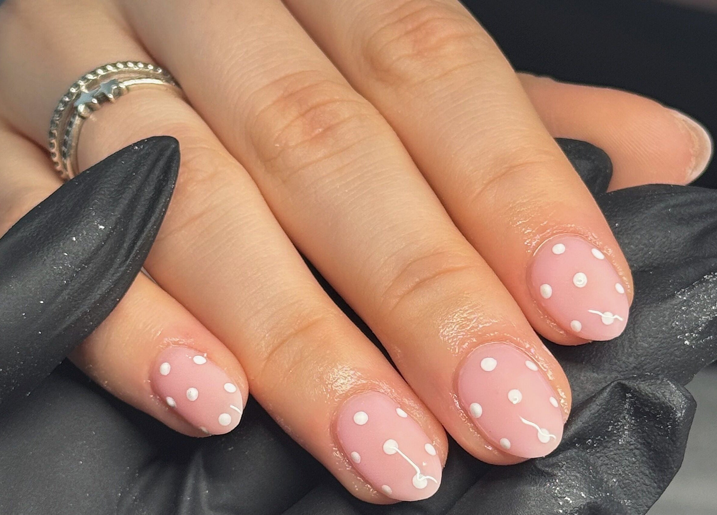 Elegant polka dot nail art at Touch Of Beauty, Blyth, England, GB, showcasing stylish pink and white design.