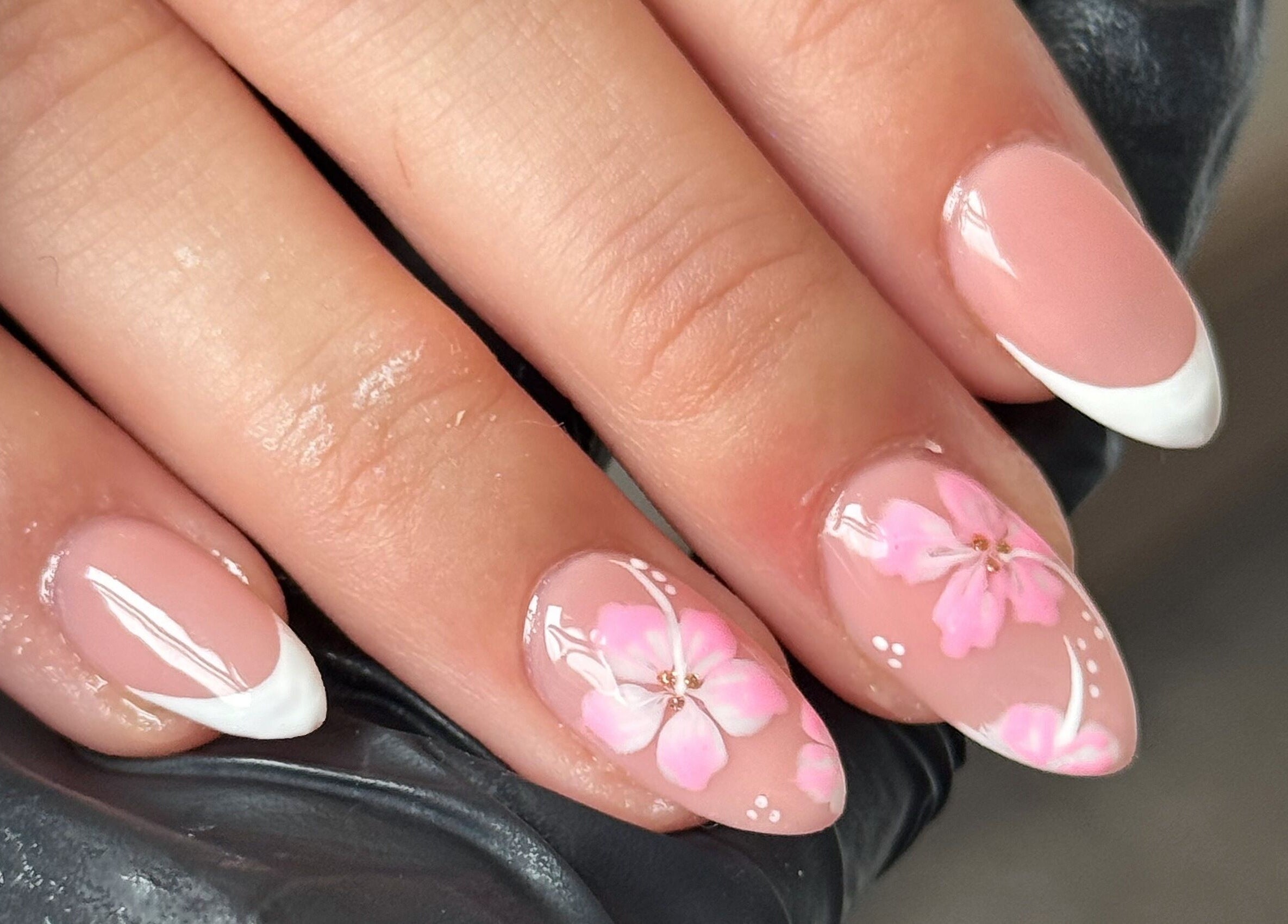 Elegant floral manicure at Touch Of Beauty in Blyth, England, GB. Features pink blossoms on almond-shaped nails.