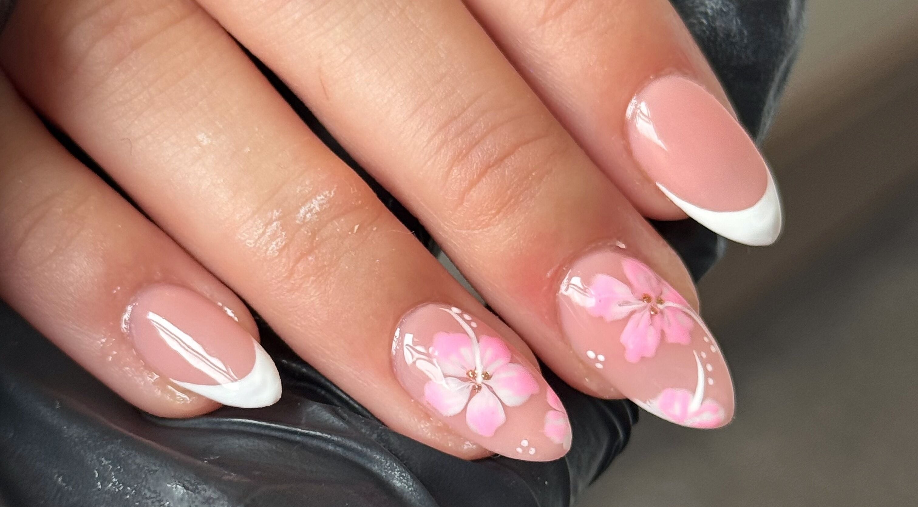Elegant floral manicure at Touch Of Beauty in Blyth, England, GB. Features pink blossoms on almond-shaped nails.