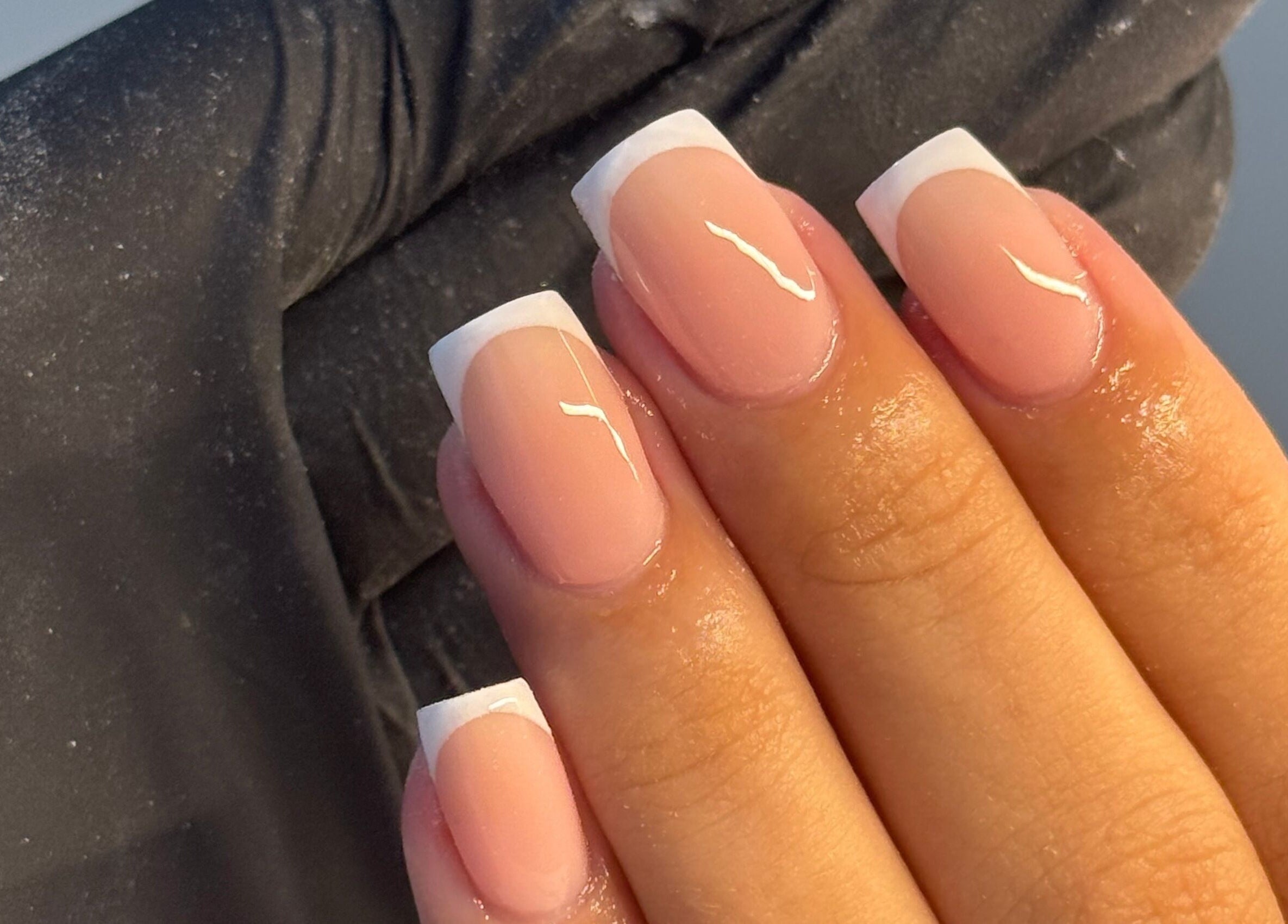 Elegant French manicure at Touch Of Beauty, Blyth, England, GB. Close-up of well-groomed nails.