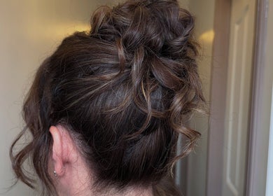 Elegant brunette updo hairstyle at Touch Of Beauty, Blyth, England, GB. Perfect for special occasions.