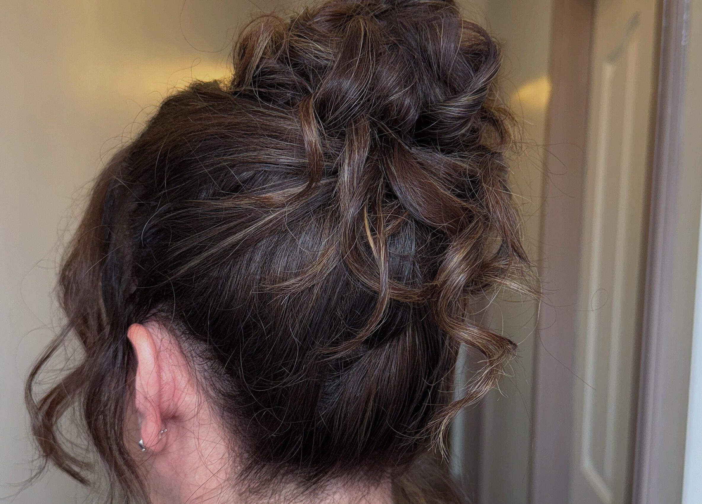 Elegant brunette updo hairstyle at Touch Of Beauty, Blyth, England, GB. Perfect for special occasions.