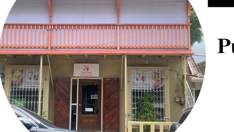 Front view of Pure Bliss Spa with charming architecture in Roseau, Saint George Parish, DM.