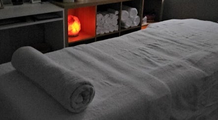 Cozy massage table with soft lighting at Tays Massage, Griffin, Queensland, AU.