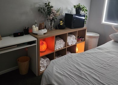 Relaxing massage room at Tays Massage in Griffin, Queensland, AU with towels and calming decor.
