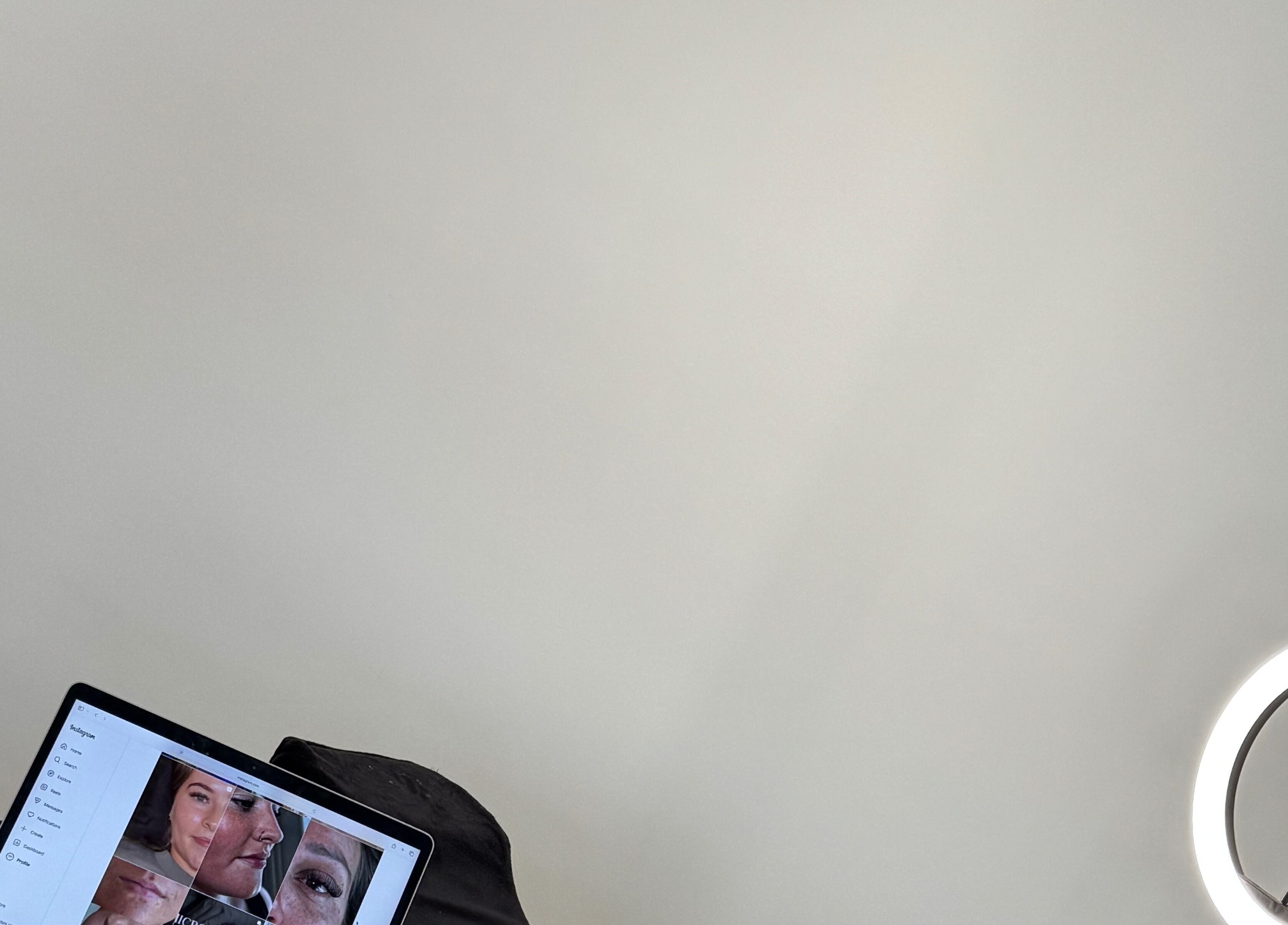 Ring light and laptop with facial images at SW Aesthetics, Kent, England, GB.