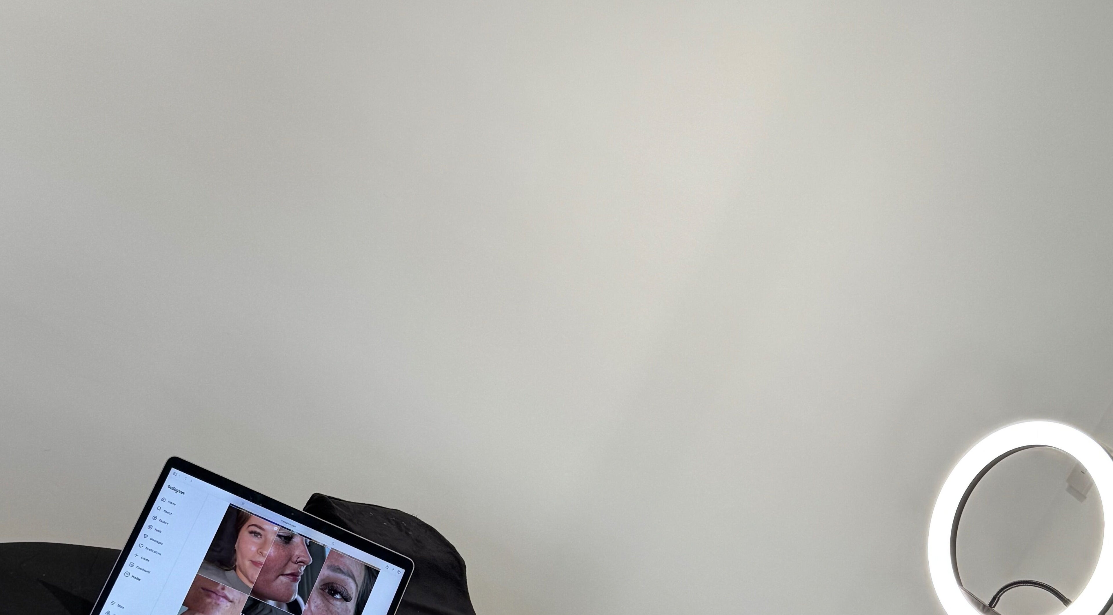 Ring light and laptop with facial images at SW Aesthetics, Kent, England, GB.