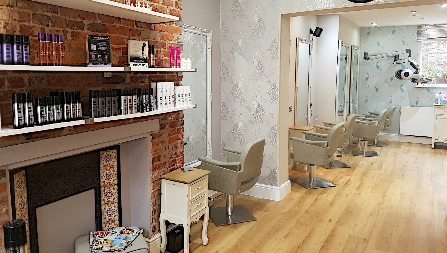 Spacious and elegant salon at Halo, Congleton, England, GB with stylish chairs and modern decor.
