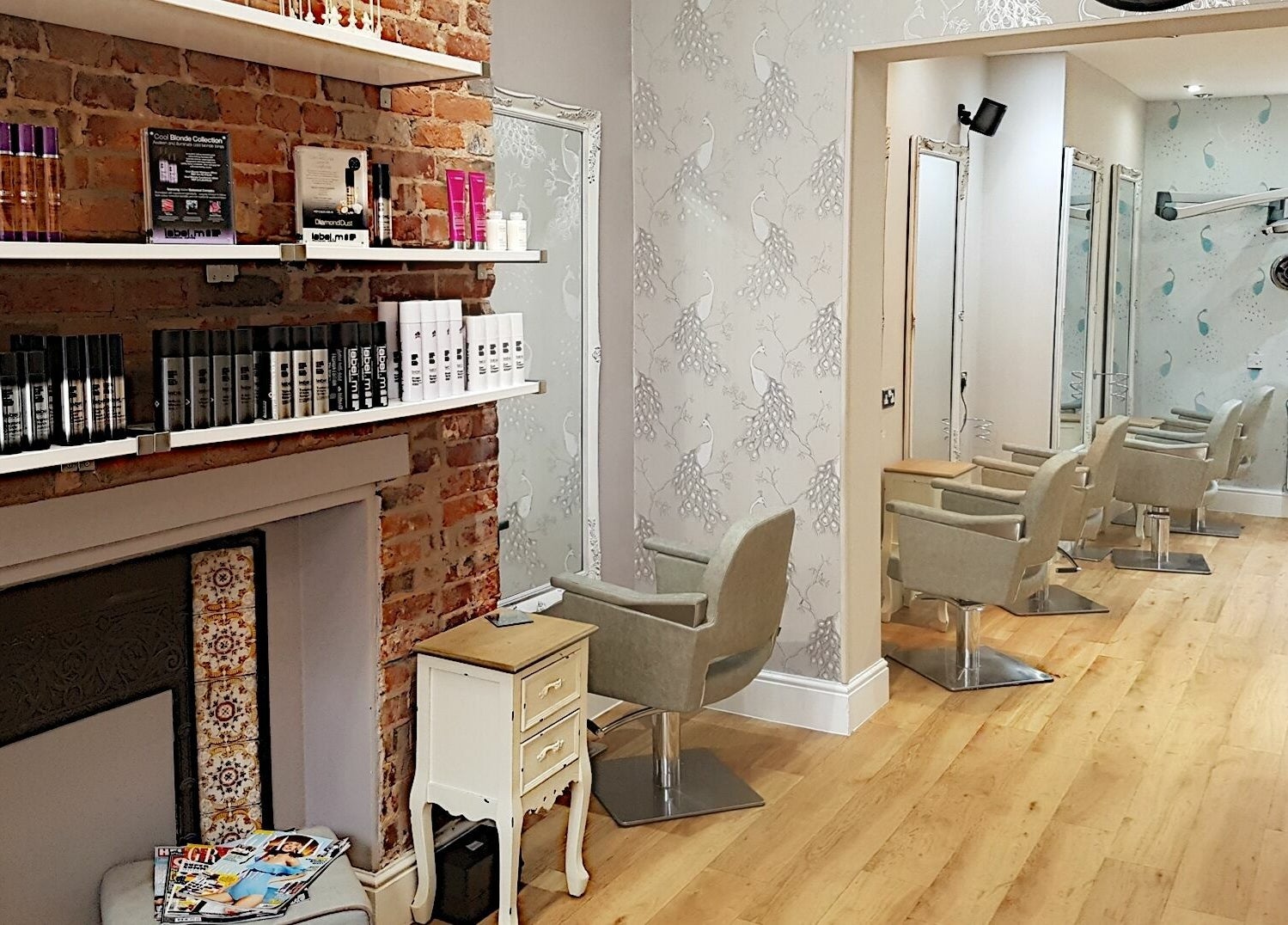Spacious and elegant salon at Halo, Congleton, England, GB with stylish chairs and modern decor.