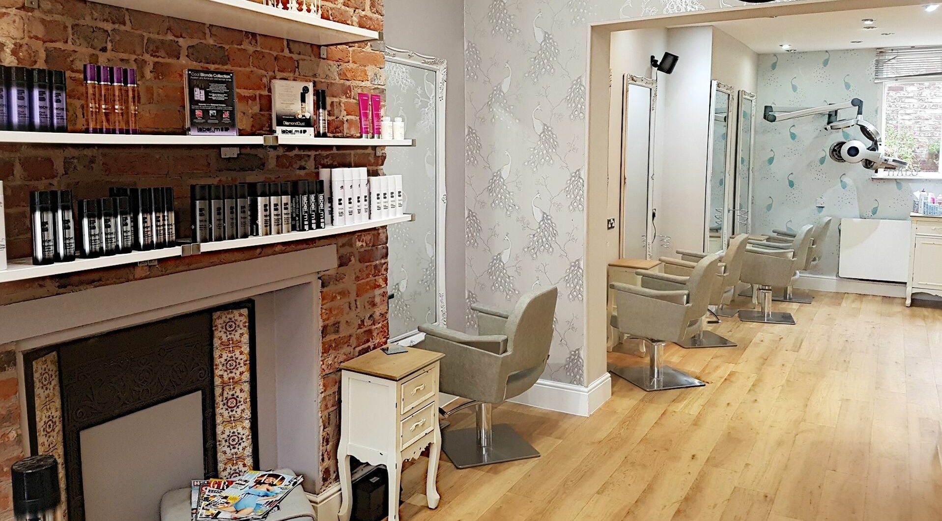 Spacious and elegant salon at Halo, Congleton, England, GB with stylish chairs and modern decor.