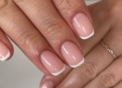 Beautiful French manicure at Beauty Fox, Glasgow, Scotland, GB showcases elegant nail design.