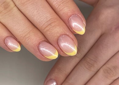 Close-up of elegant yellow-tipped nails at Beauty Fox, Glasgow, Scotland, GB.