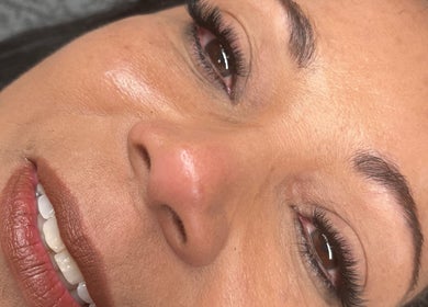 Close-up of a smiling woman showcasing perfect eyelashes at The Beauty Spot_Cpt, Cape Town, Western Cape, ZA.