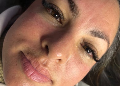 Close-up of a client with flawless skin and long lashes at The Beauty Spot_Cpt, Cape Town, Western Cape, ZA.