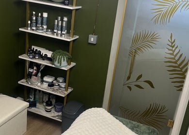 Product display at Ella Bella beauty, Leek, England, GB, featuring skincare items on elegant shelves.