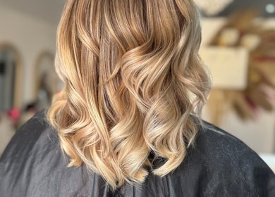 Blonde curls styled at Denise’s Styles in St Helens, England, GB salon.
