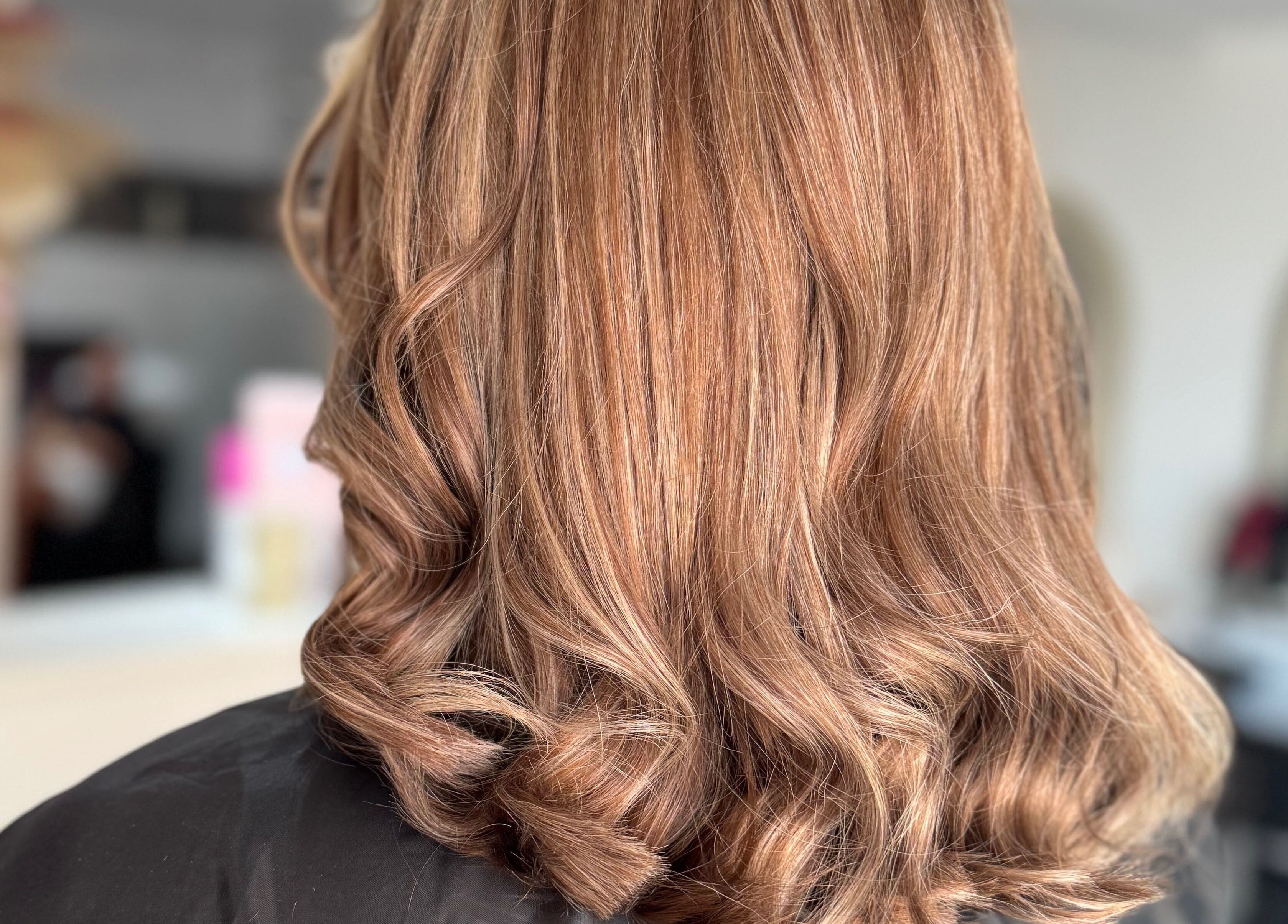 Golden brown wavy hairstyle at DKB hairdressing, St Helens, England, GB.