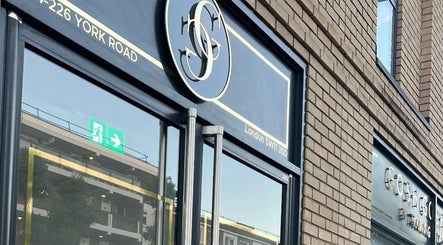 Entrance of London Aesthetic Clinic in London, England, GB, featuring sleek signage and glass doors.