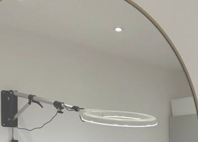 Modern beauty treatment room at London Aesthetic Clinic - Battersea, London, England, GB with a lighted mirror.