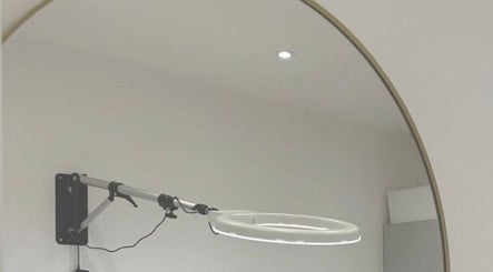 Modern beauty treatment room at London Aesthetic Clinic - Battersea, London, England, GB with a lighted mirror.