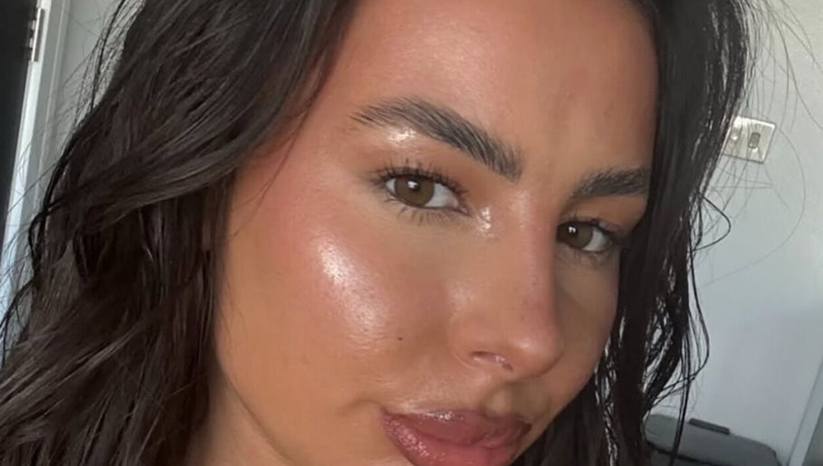 A woman with glowing skin, showcasing beauty treatment at London Aesthetic Clinic - Canary Wharf, London, England, GB.