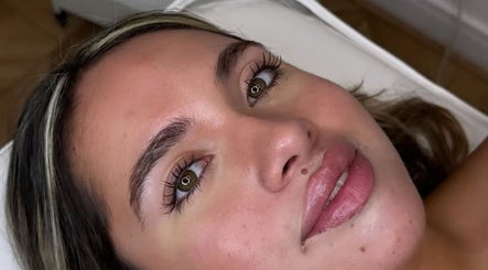 Close-up of a client's radiant face after a treatment at London Aesthetic Clinic - Canary Wharf, London, England, GB.
