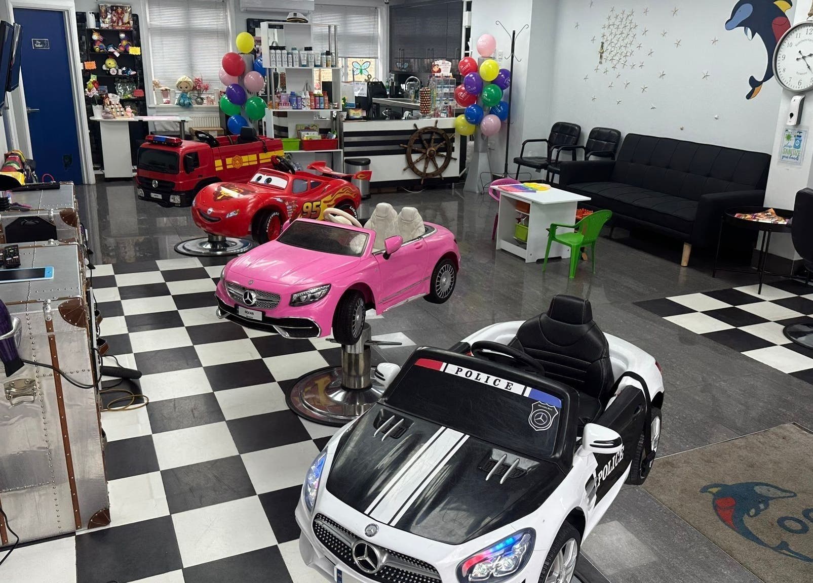 Ocean Kids and Family Salon in Radlett, England, GB with colorful car chairs for children.