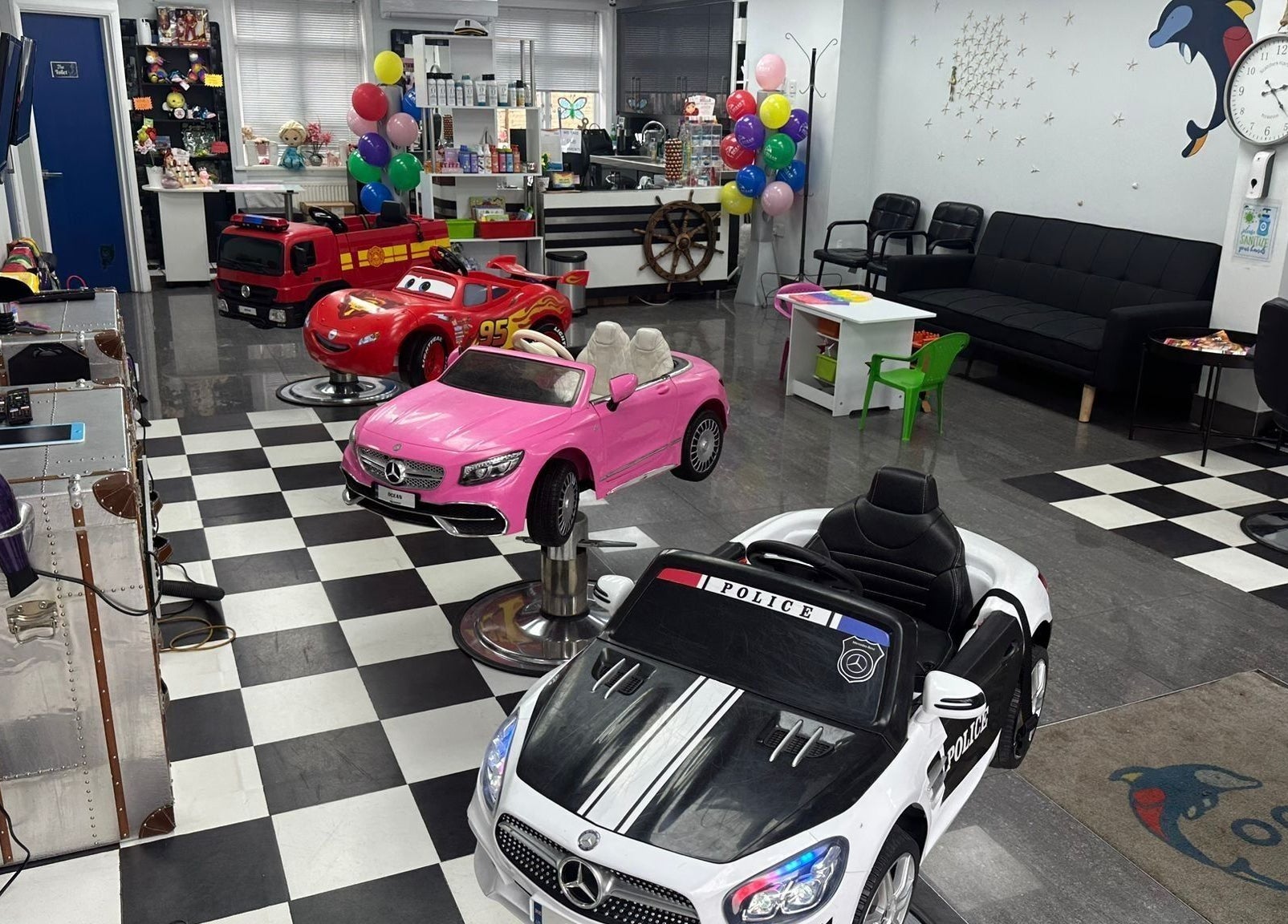Ocean Kids and Family Salon in Radlett, England, GB with colorful car chairs for children.