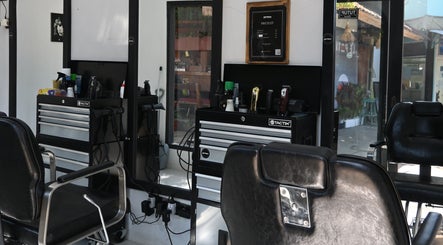 Interior of Gili Mates Barbershop showcasing chic barber chairs and grooming tools in Nusa Tenggara Barat, ID.