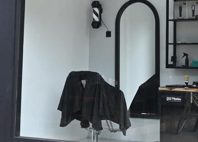 Sleek interior of Gili Mates Barbershop, Nusa Tenggara Barat, showcasing stylish barber chair and grooming tools.