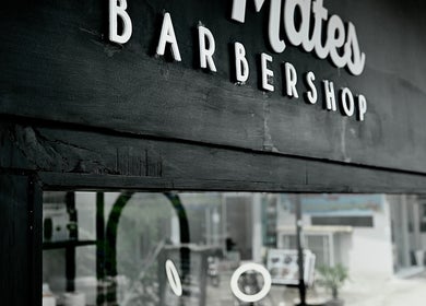Gili Mates Barbershop entrance in Nusa Tenggara Barat, ID showcasing modern signage.