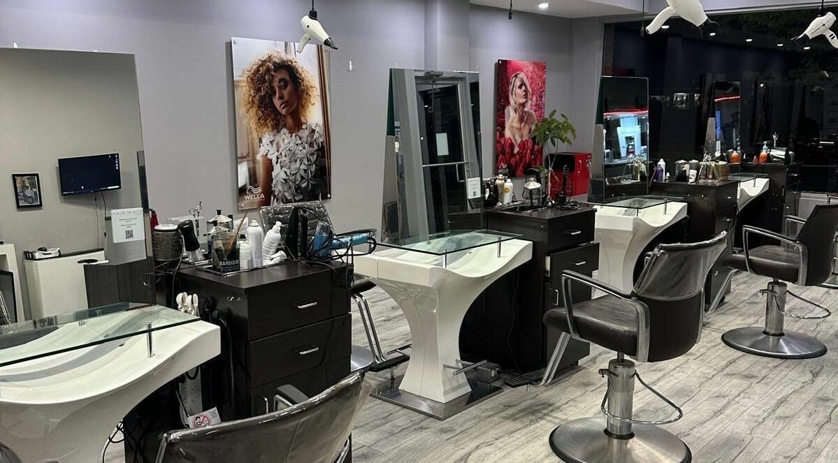 Modern salon chairs and mirrors at Hairxtacy Salon, Burlington, Ontario, CA, showcasing stylish interiors.