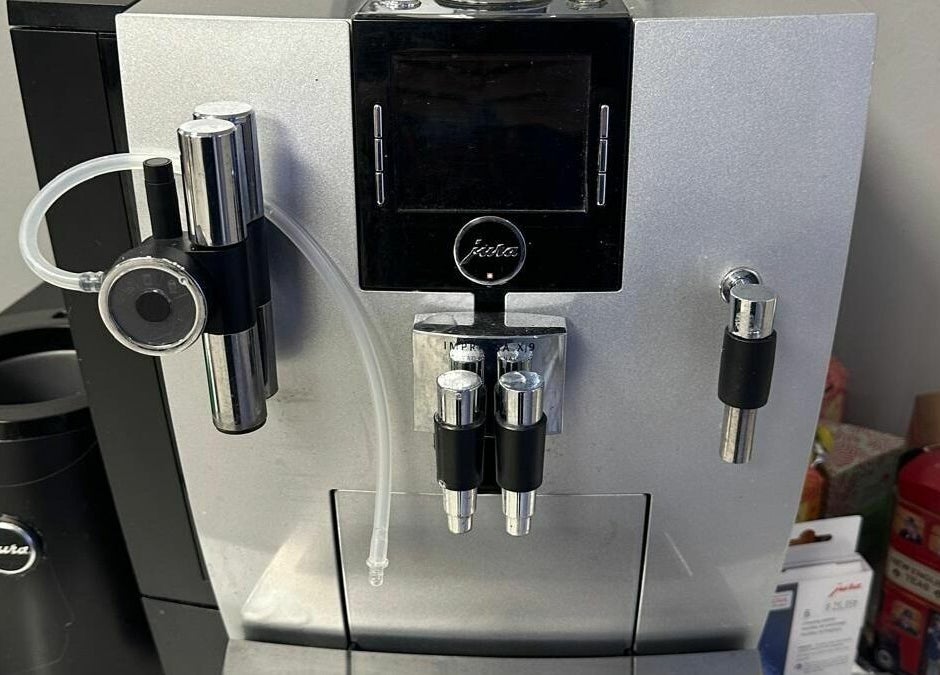 Jura coffee machine at Hairxtacy Salon, Burlington, Ontario, CA, offering premium refreshments.
