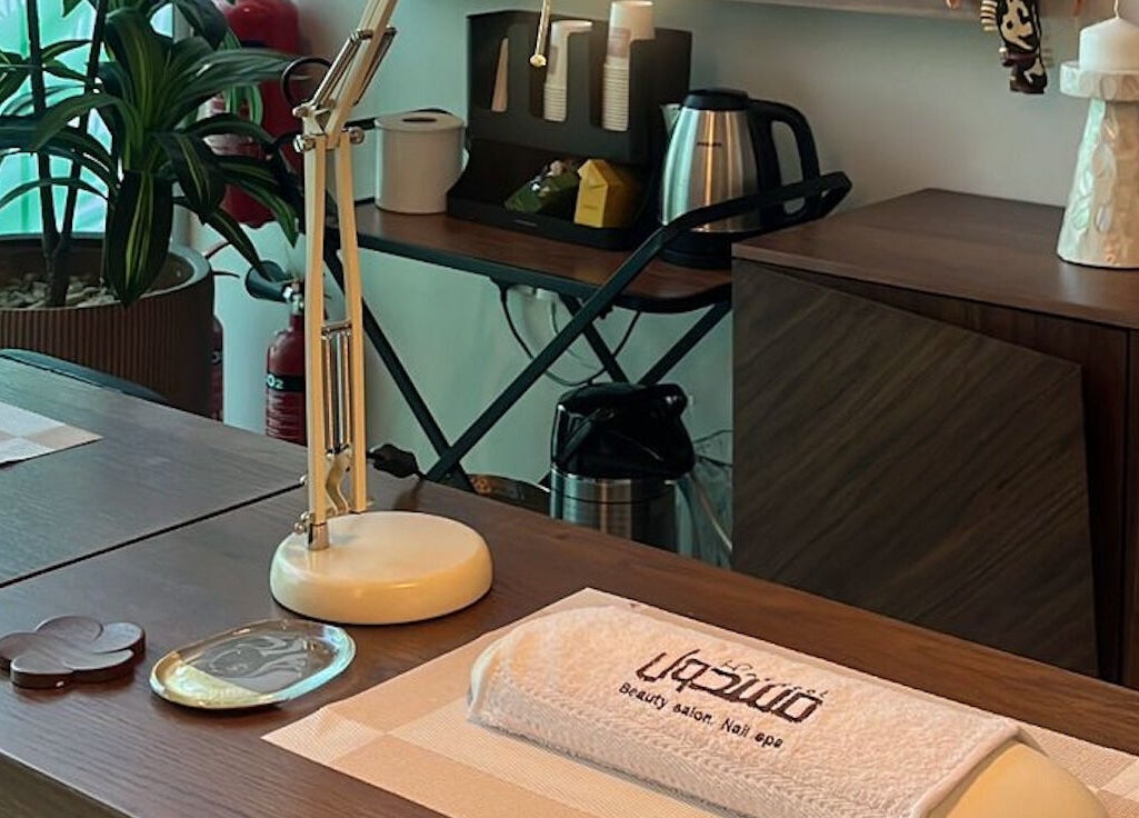 Elegant spa desk setup at Masdool Salon, Dammam, Eastern Province, SA with decor and modern amenities.