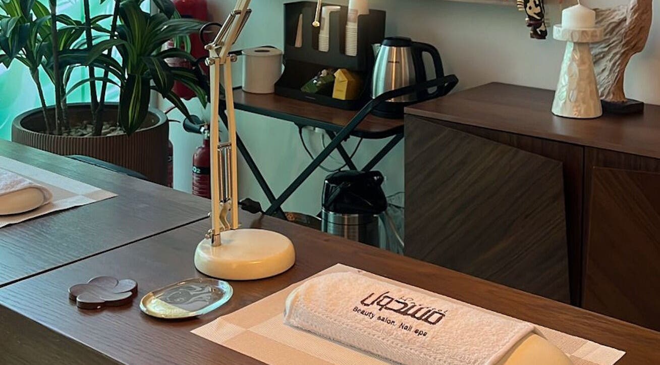 Elegant spa desk setup at Masdool Salon, Dammam, Eastern Province, SA with decor and modern amenities.