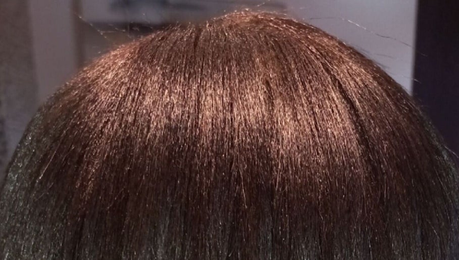 Shiny brown hair at Miss J'z Hair and Beauty Bar in Cape Town, Western Cape, ZA.