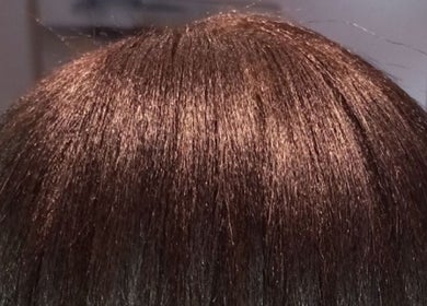Shiny brown hair at Miss J'z Hair and Beauty Bar in Cape Town, Western Cape, ZA.