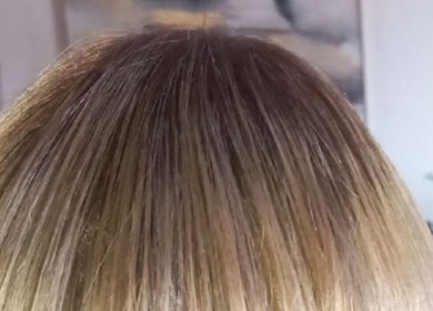 Glossy hair showcased at Miss J'z Hair and Beauty Bar, Cape Town, Western Cape, ZA.