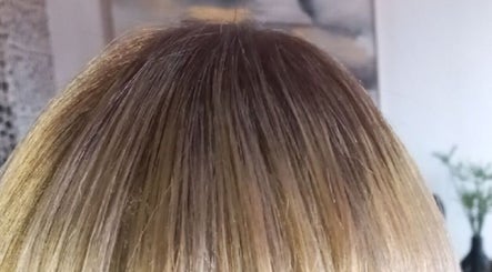 Glossy hair showcased at Miss J'z Hair and Beauty Bar, Cape Town, Western Cape, ZA.
