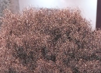 Close-up of natural textured curls at Miss J'z Hair and Beauty Bar, Cape Town, Western Cape, ZA.